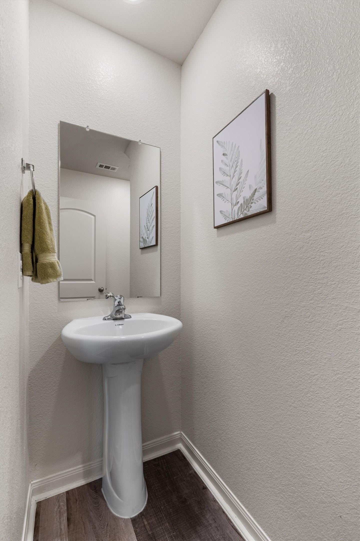 163 Niven Path, Unit 12K Jarrell, TX 76537 - Photo 14 of 31 a bathroom with a sink and mirror