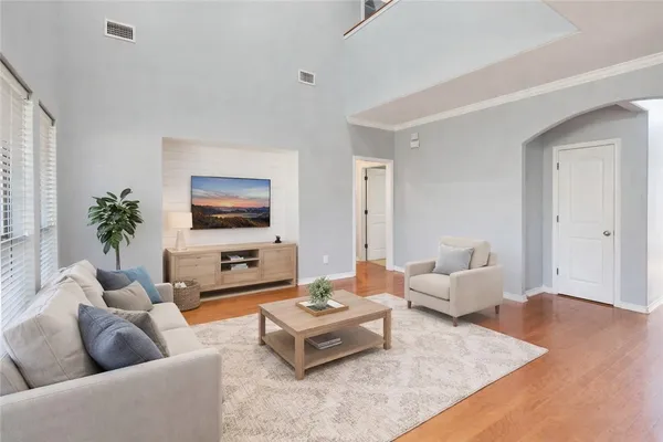 a living room with furniture and a flat screen tv