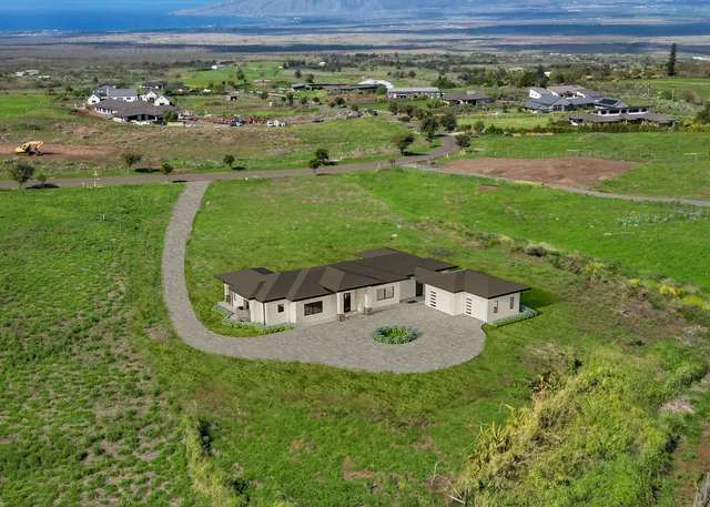 a view of a swimming pool with a yard