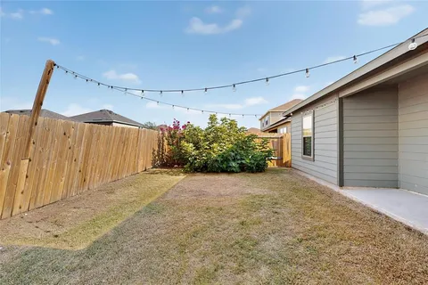 a view of a back yard of the house