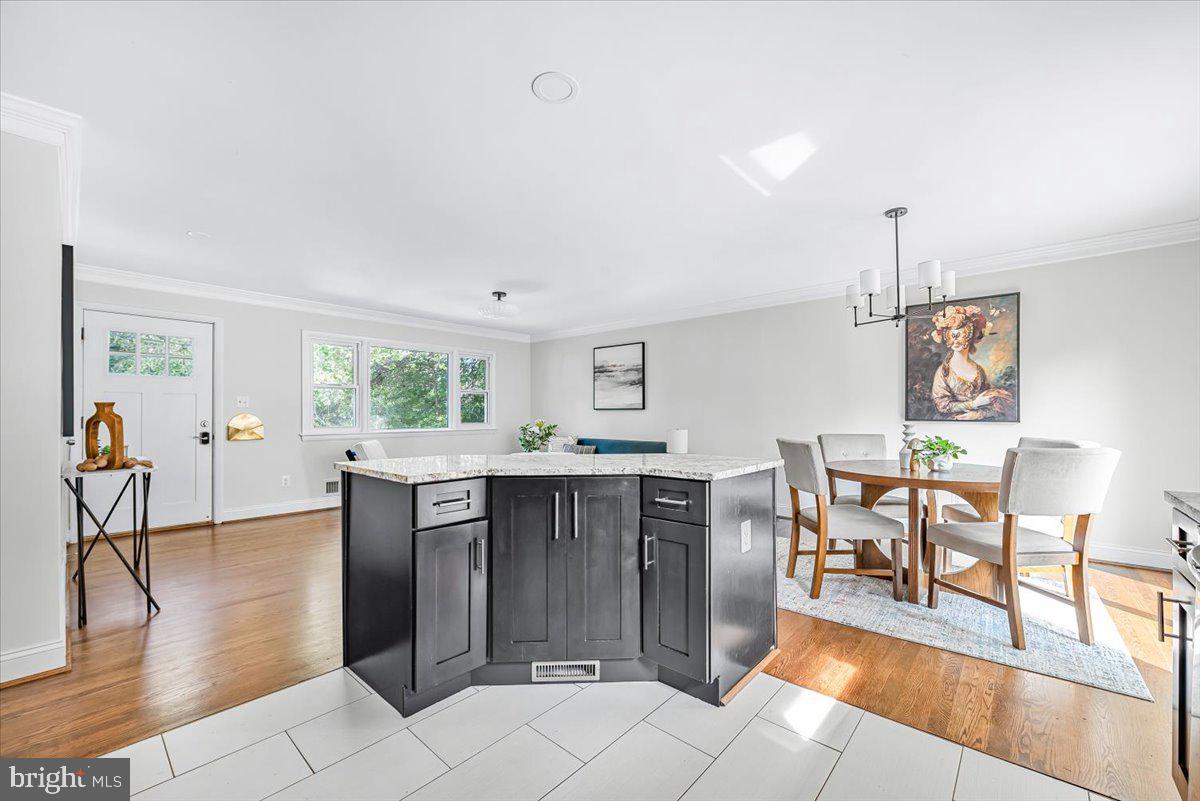 9805 Gardiner Avenue Silver Spring, MD 20902 - Photo 11 of 34 a view of a livingroom with furniture window and wooden floor