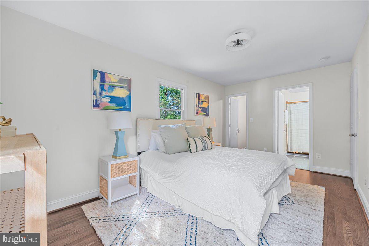 9805 Gardiner Avenue Silver Spring, MD 20902 - Photo 14 of 34 a bedroom with a bed and a couch