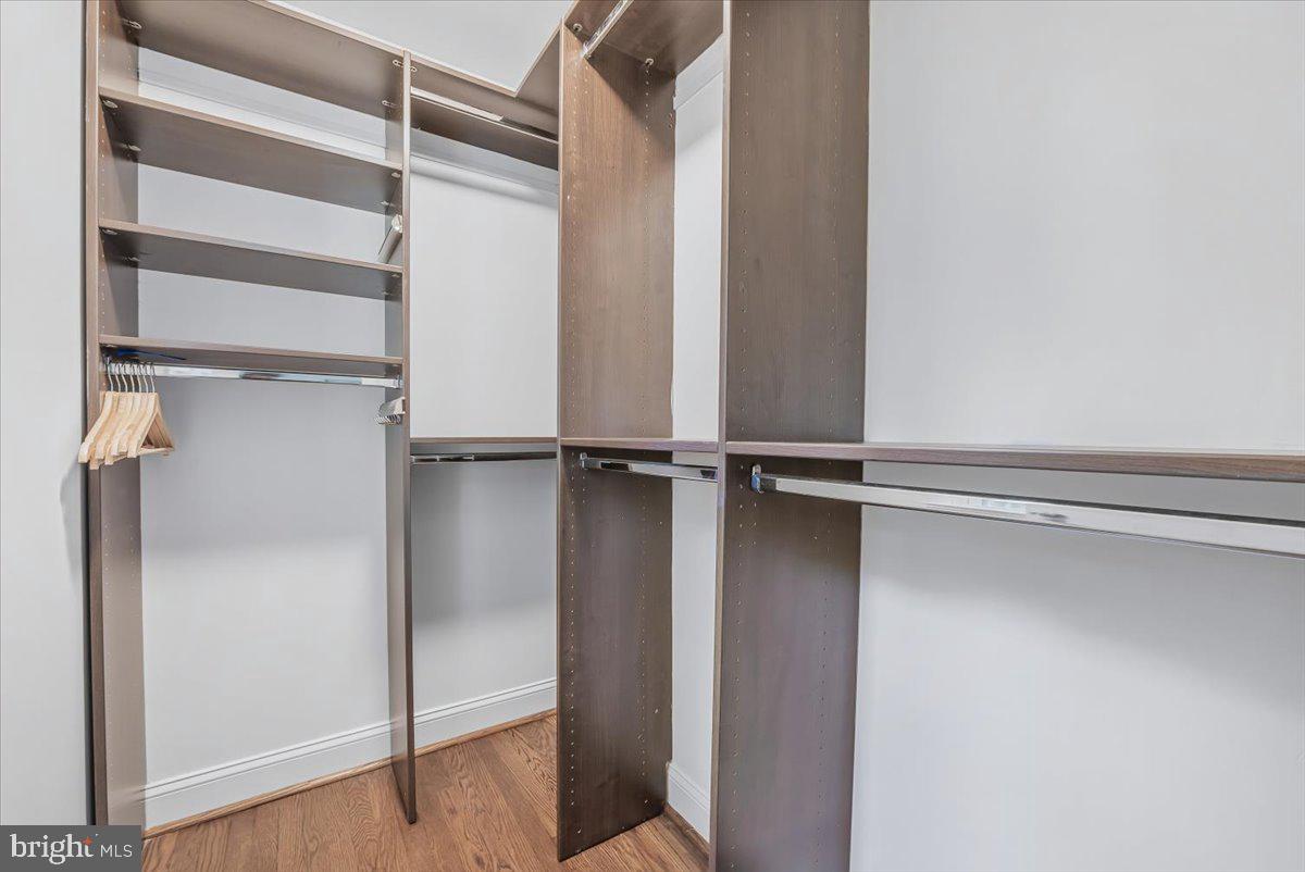 9805 Gardiner Avenue Silver Spring, MD 20902 - Photo 16 of 34 a view of walk in closet with empty racks