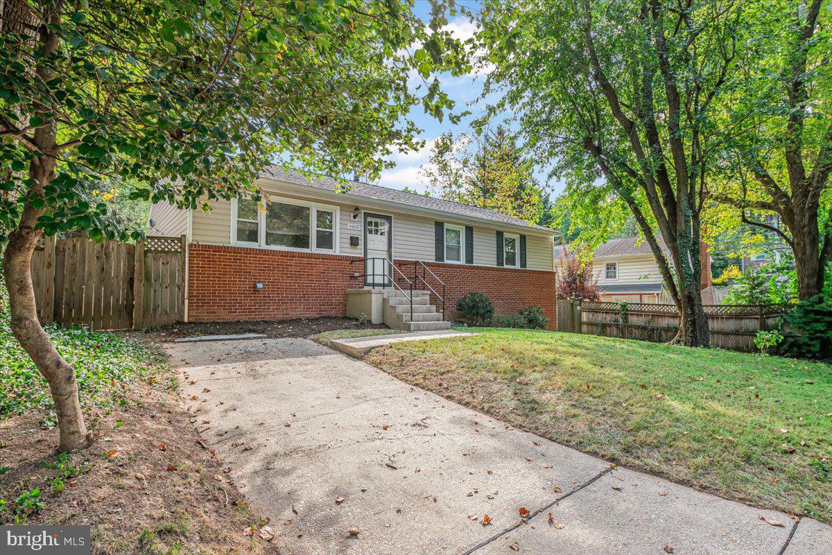 9805 Gardiner Avenue Silver Spring, MD 20902 - Photo 2 of 34 front view of a house with a yard