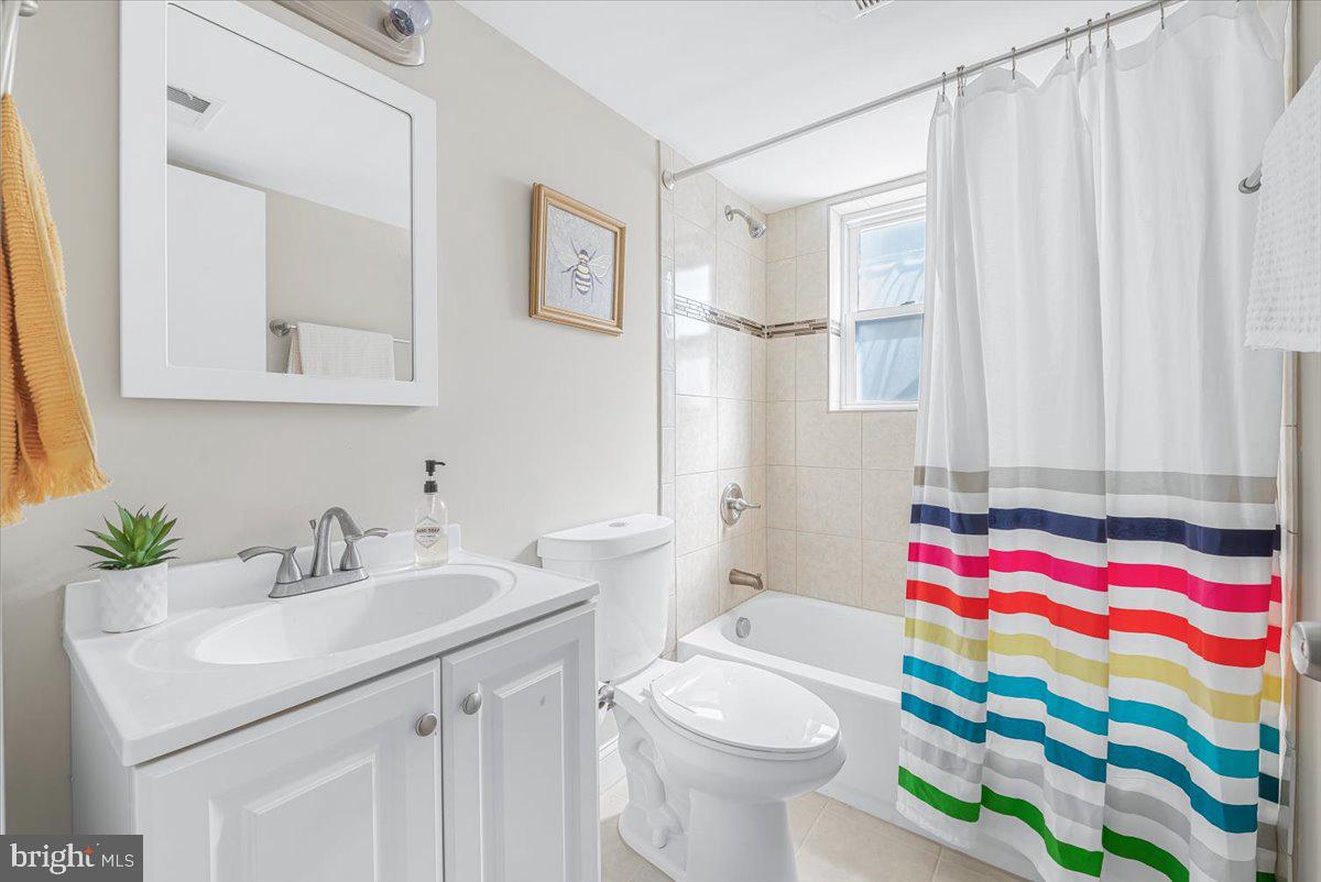 9805 Gardiner Avenue Silver Spring, MD 20902 - Photo 21 of 34 a bathroom with a sink toilet and shower