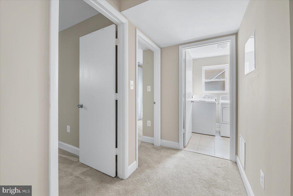 9805 Gardiner Avenue Silver Spring, MD 20902 - Photo 22 of 34 a view of an empty room with closet and a window