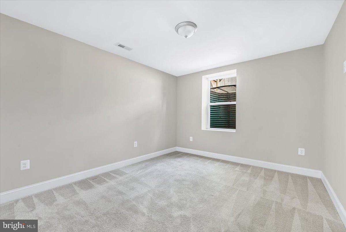 9805 Gardiner Avenue Silver Spring, MD 20902 - Photo 23 of 34 a view of an empty room with a window