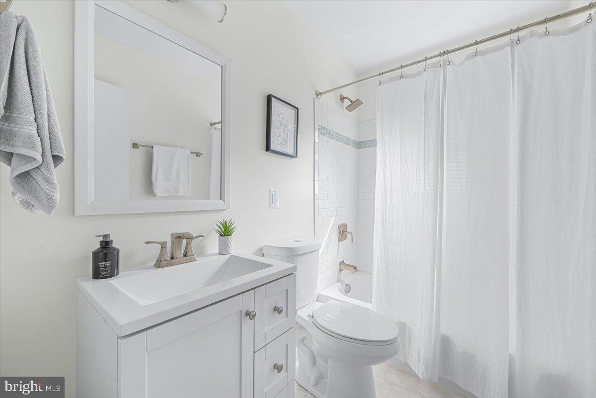 9805 Gardiner Avenue Silver Spring, MD 20902 - Photo 26 of 34 a bathroom with a sink toilet and vanity