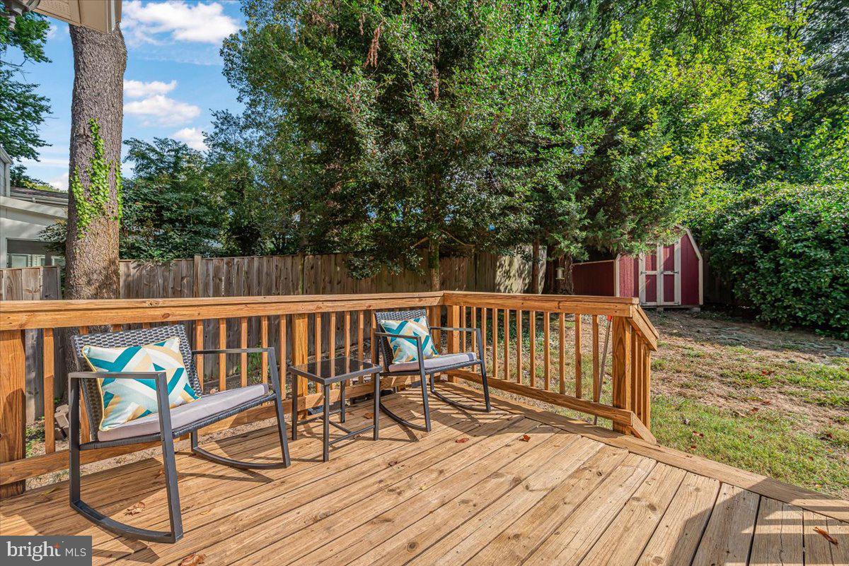 9805 Gardiner Avenue Silver Spring, MD 20902 - Photo 27 of 34 a view of balcony with wooden floor and fence