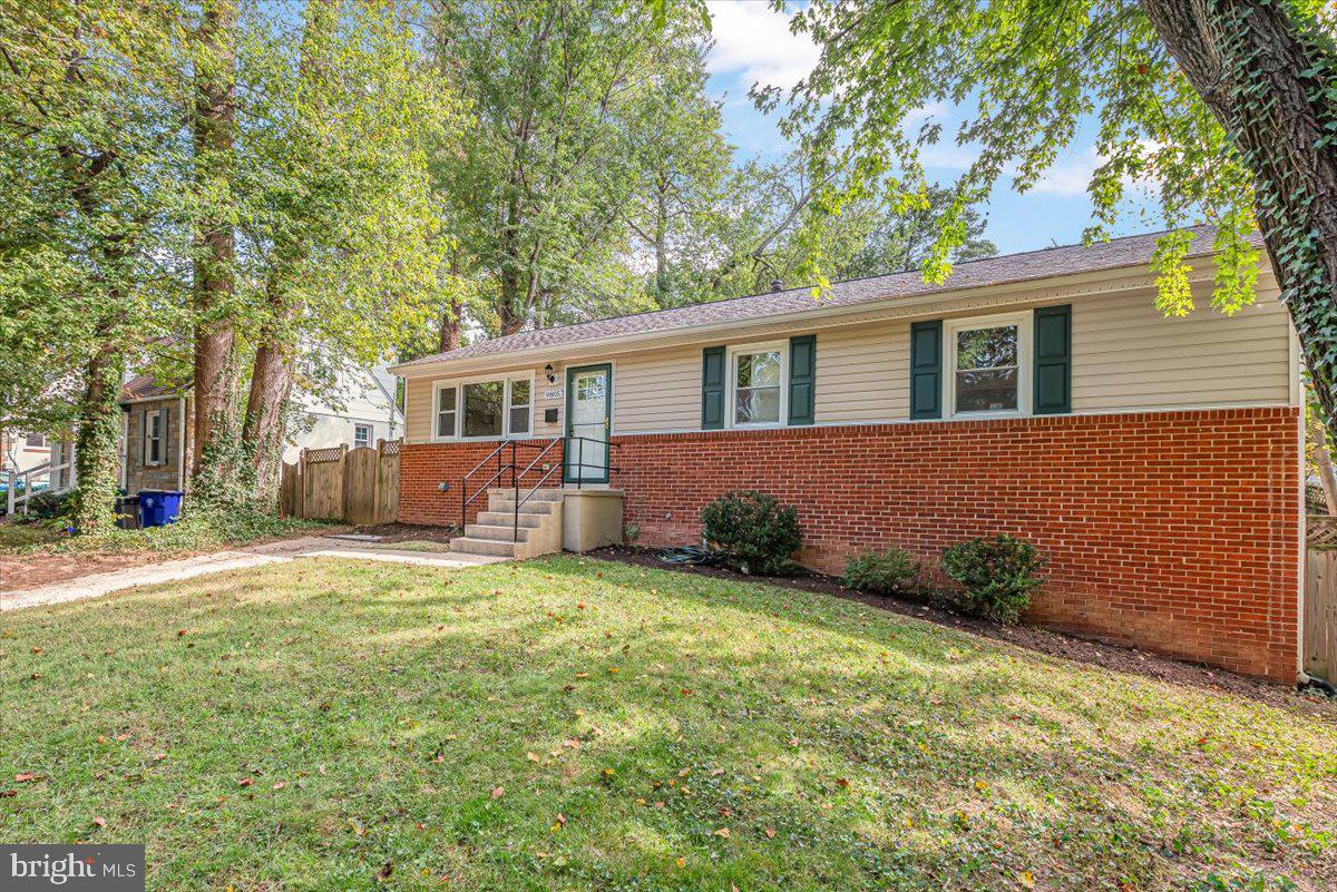 9805 Gardiner Avenue Silver Spring, MD 20902 - Photo 3 of 34 a house view with a garden space