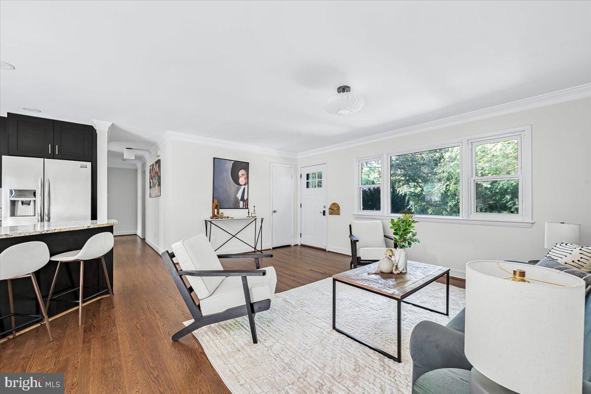 9805 Gardiner Avenue Silver Spring, MD 20902 - Photo 5 of 34 a living room with furniture and a window