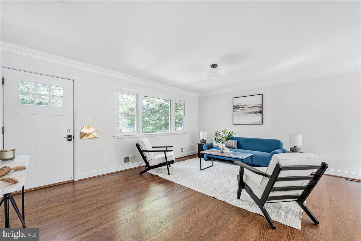 9805 Gardiner Avenue Silver Spring, MD 20902 - Photo 6 of 34 a living room with furniture and a window