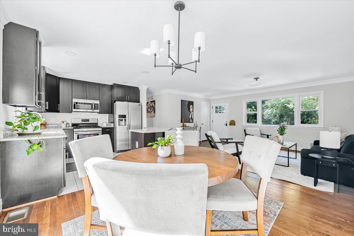 9805 Gardiner Avenue Silver Spring, MD 20902 - Photo 8 of 34 a view of kitchen with dining table and chairs