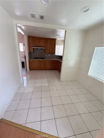 a view of an empty room and a window