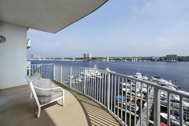 211 Durango Road, Unit 516 Destin, FL 32541 - Photo 2 of 27 a balcony with wooden floor outdoor space and city view