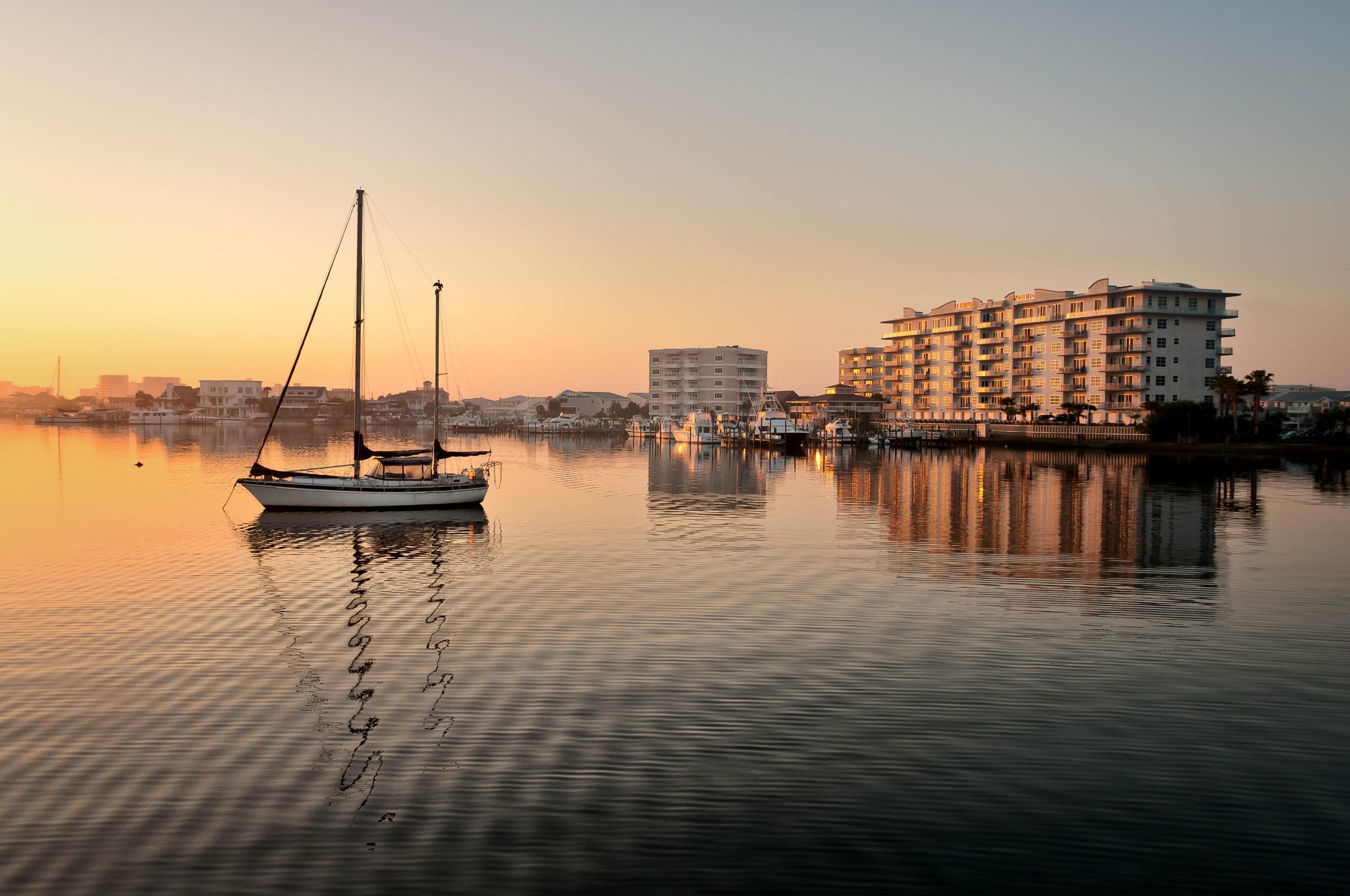 211 Durango Road, Unit 516 Destin, FL 32541 - Photo 27 of 27 a view of a lake with boats and trees in the background