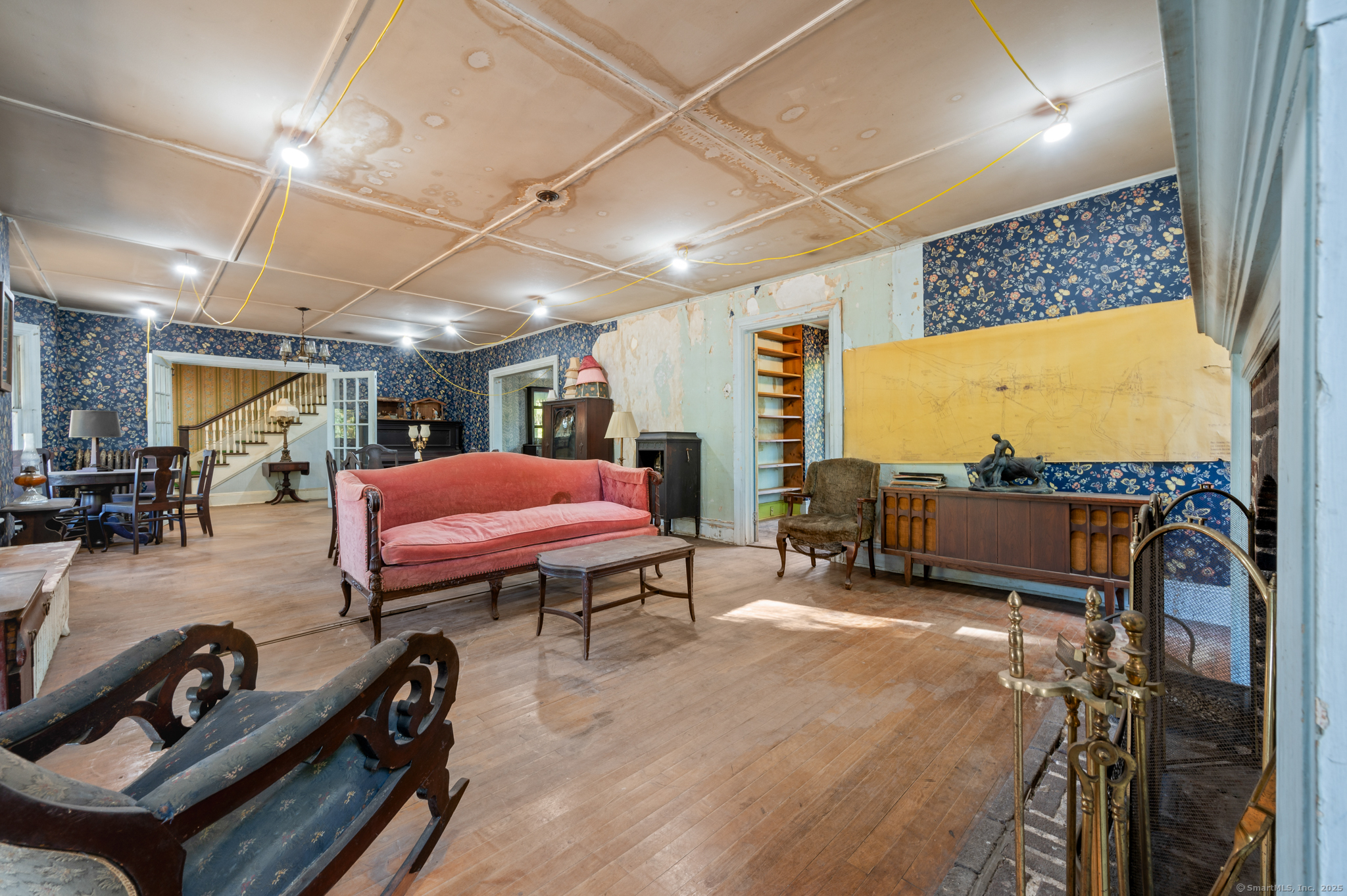 124 River Road Willington, CT 06279 - Photo 11 of 38 a living room with furniture a flat screen tv and a table