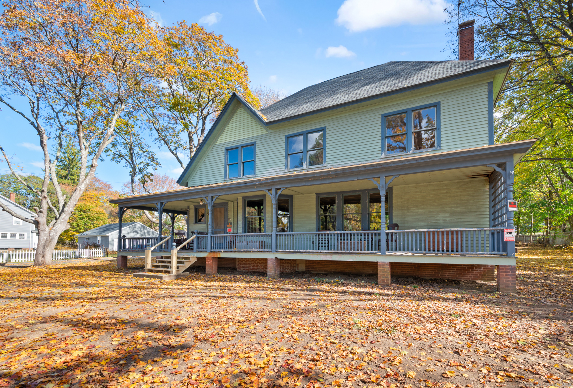 124 River Road Willington, CT 06279 - Photo 2 of 38 a front view of a house with a yard