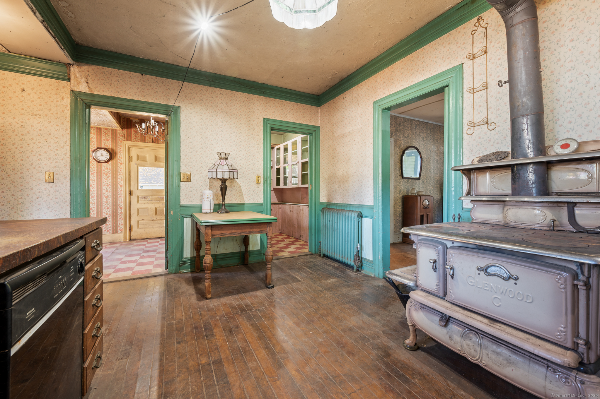 124 River Road Willington, CT 06279 - Photo 22 of 38 a room with fireplace furniture and a wooden floor