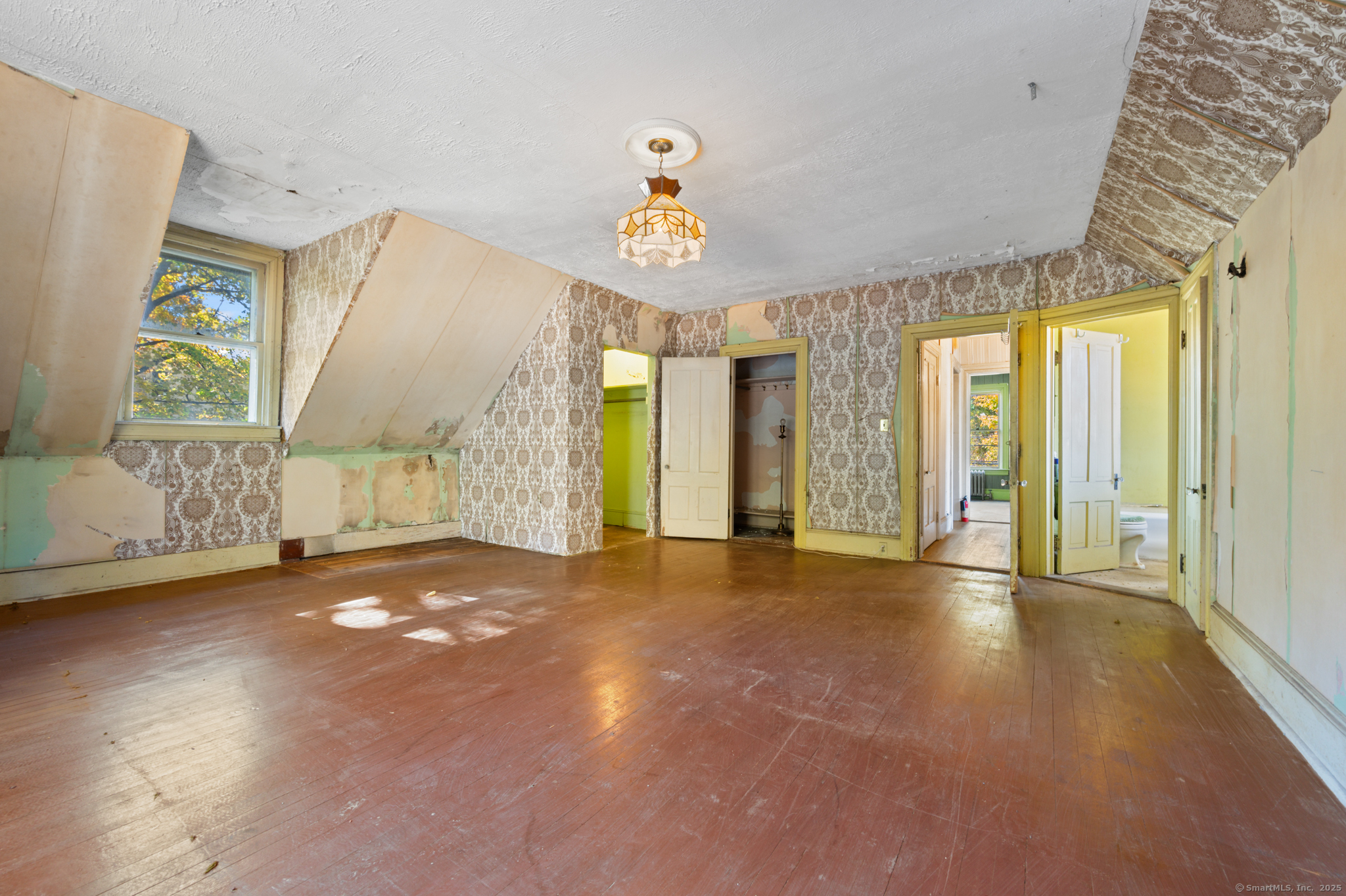 124 River Road Willington, CT 06279 - Photo 28 of 38 a view of an empty room with glass door and windows