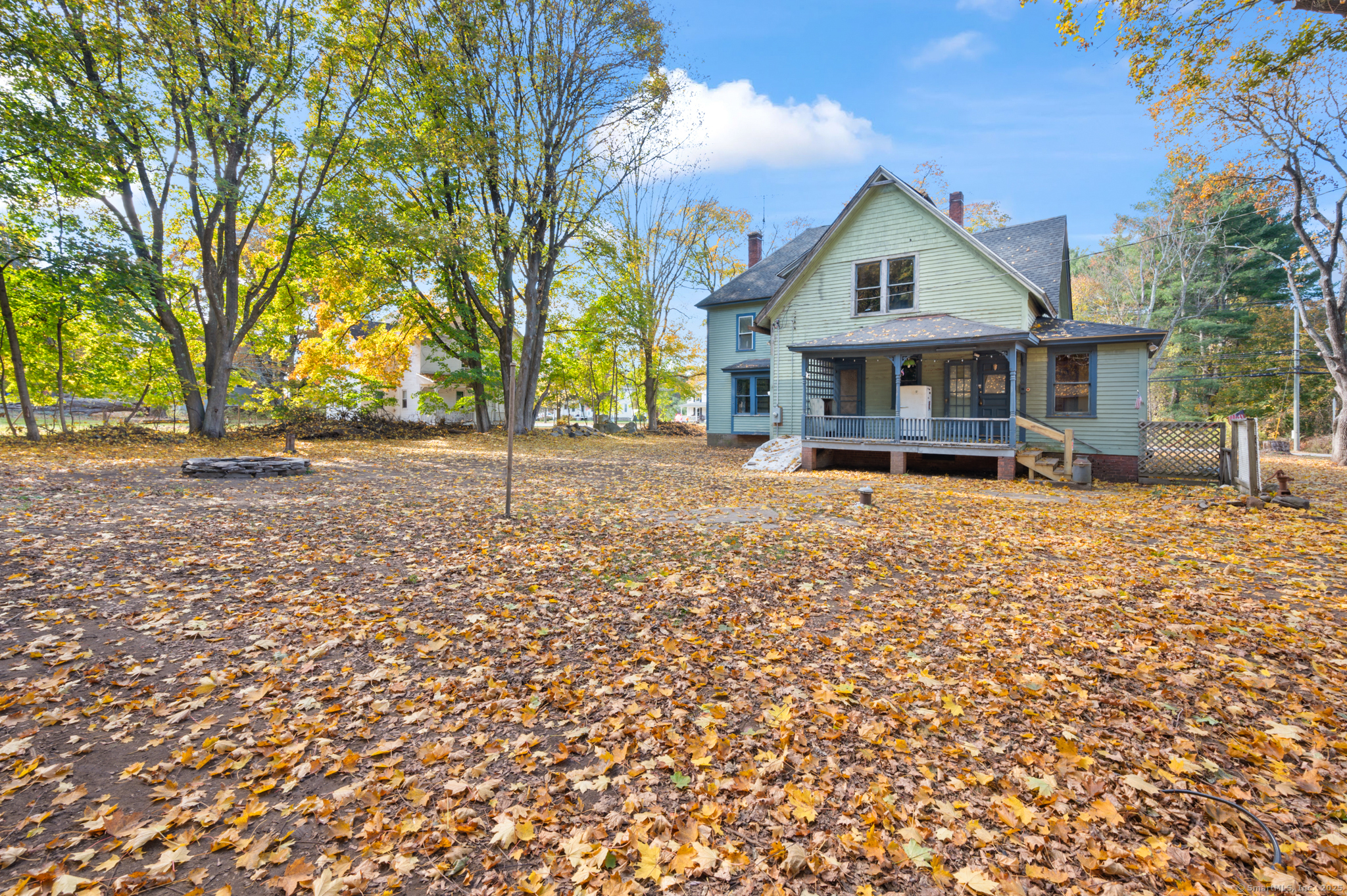 124 River Road Willington, CT 06279 - Photo 5 of 38 front view of a house with a street