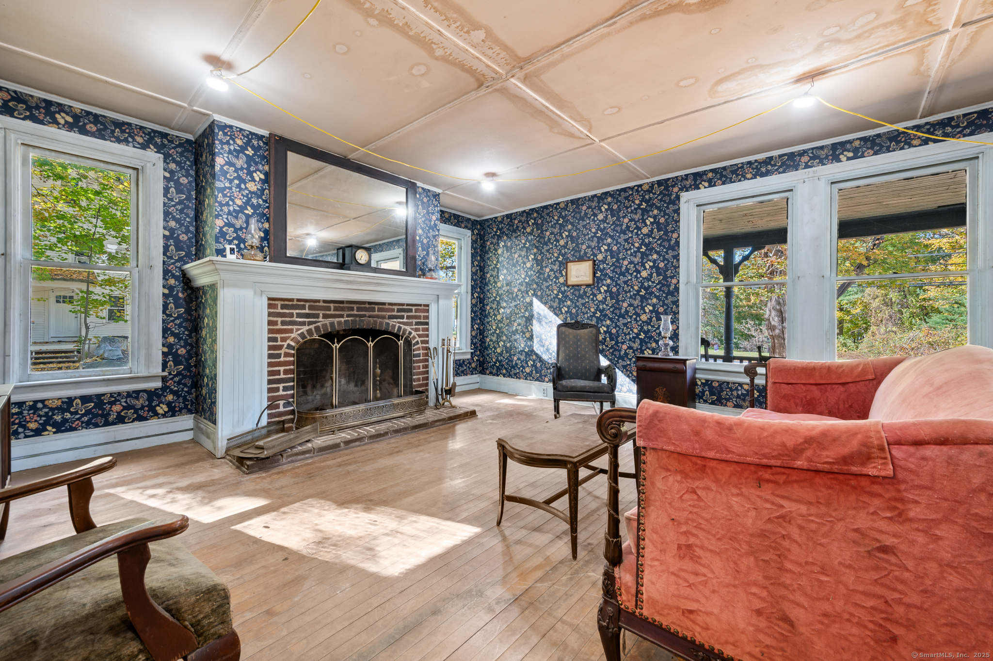 124 River Road Willington, CT 06279 - Photo 9 of 38 a living room with furniture a window and a fireplace