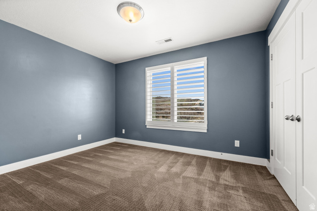 14728 South Canyon Pointe Road Draper, UT 84020 - Photo 23 of 35 Carpeted room featuring a single window with white horizontal blinds, white baseboards, and a flush mount ceiling light