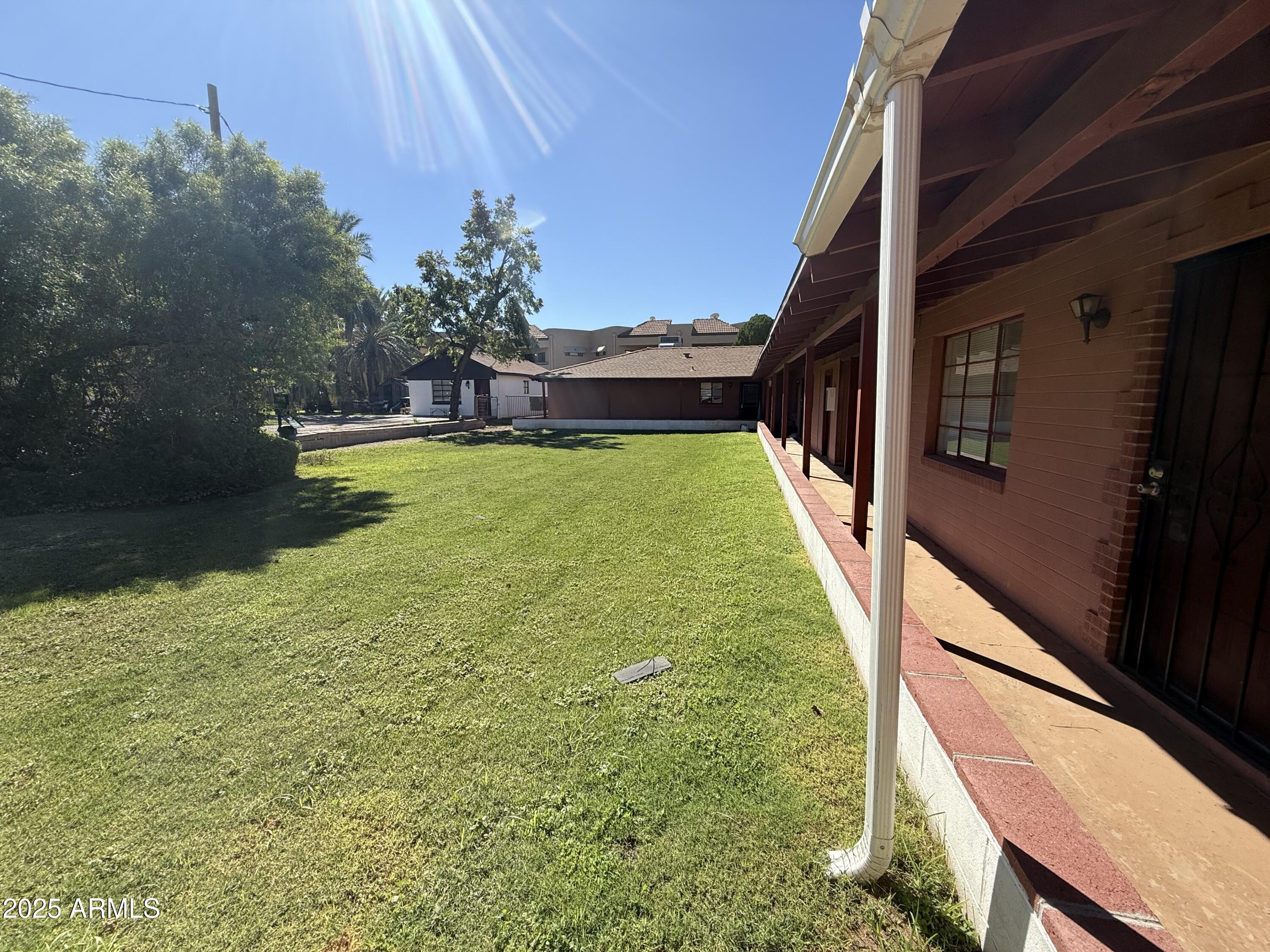 5107 East Oak Street, Unit 3 Phoenix, AZ 85008 - Photo 2 of 6 a view of a swimming pool with a yard