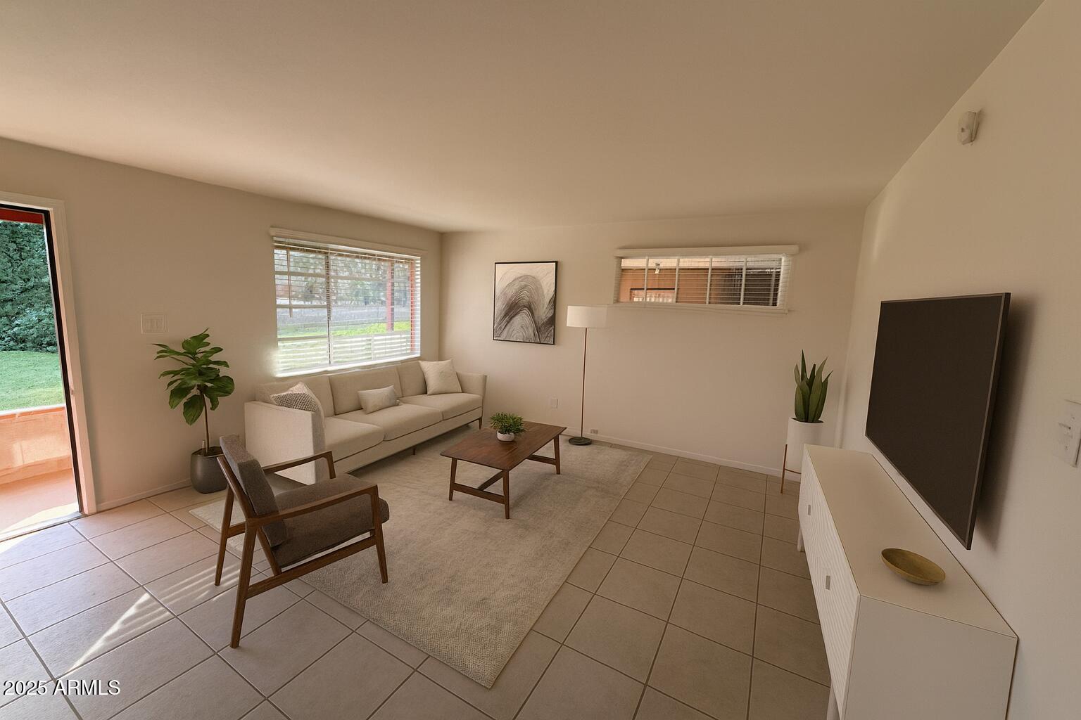 5107 East Oak Street, Unit 3 Phoenix, AZ 85008 - Photo 3 of 6 a living room with furniture and a flat screen tv