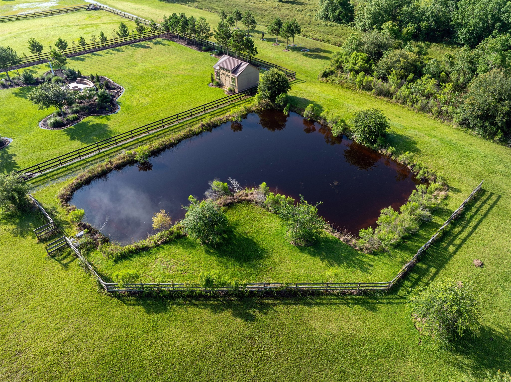 7706 Pebble Hill Lane Rosharon, TX 77583 - Photo 7 of 16 a view of a lake with a yard