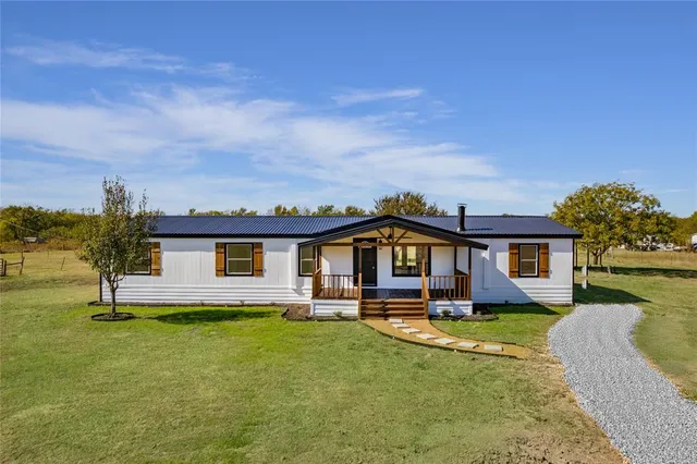 front view of a house with a yard