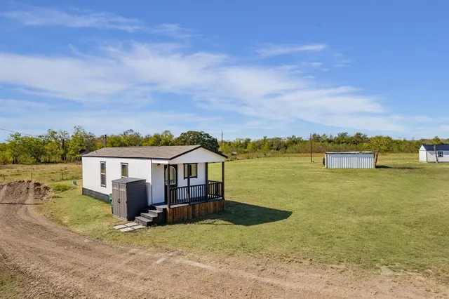 a view of a lake with a house in the background