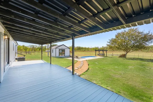 a view of swimming pool with a yard