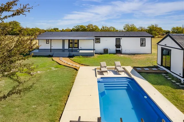 a view of a house with swimming pool