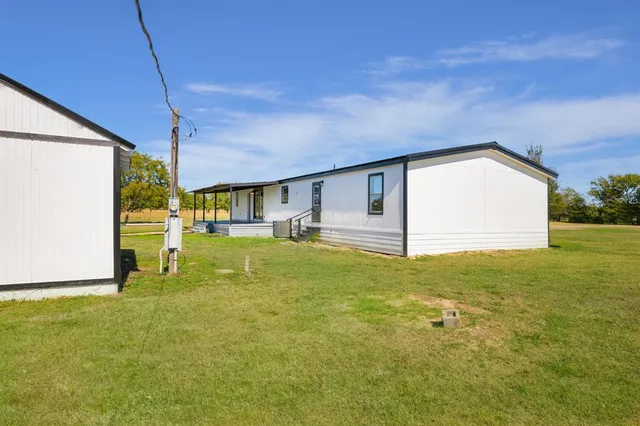 a front view of house with yard