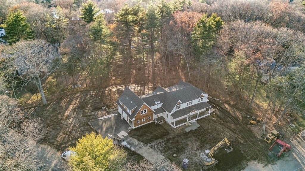 57 Longfellow Road Sudbury, MA 01776 - Photo 20 of 23 an aerial view of a house with a yard and wooden fence