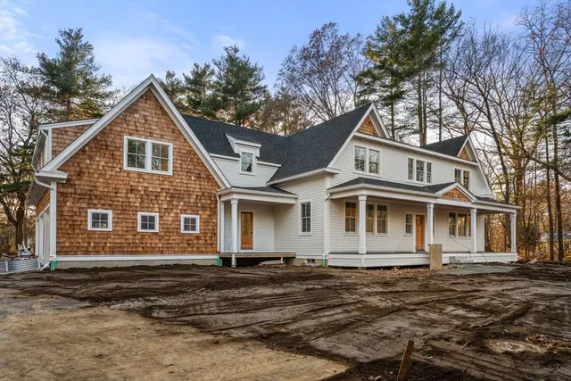 a front view of a house with yard