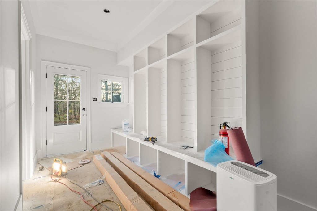 57 Longfellow Road Sudbury, MA 01776 - Photo 10 of 23 a bathroom with a double vanity sink and a mirror