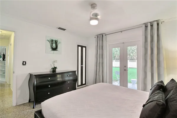 a bedroom with a bed and a dresser