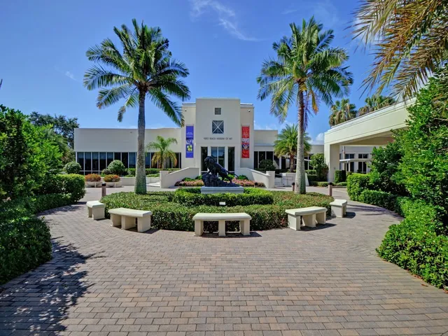 a front view of a house with garden and porch