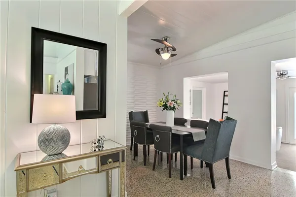 a dining room with furniture and window