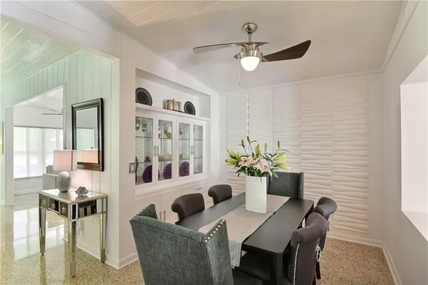 a living room with furniture and chandelier