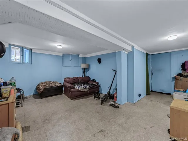 a bedroom with furniture and a gym equipment