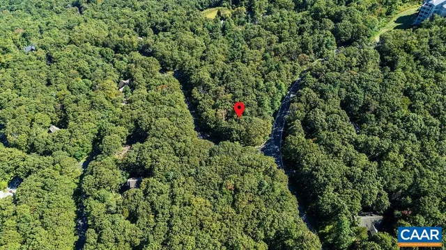 an aerial view of residential house and outdoor space