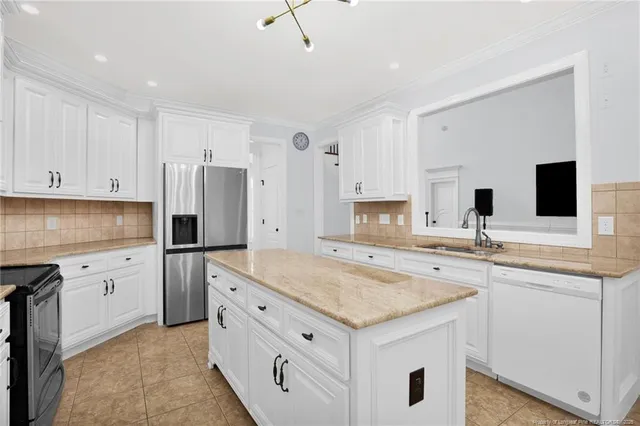 a kitchen with a sink stove and refrigerator