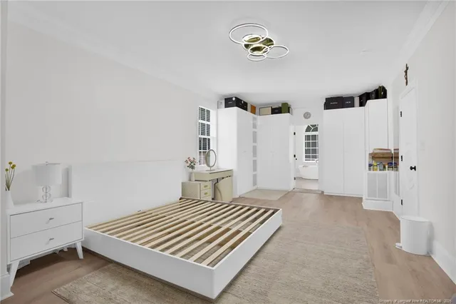 a bedroom with a bed and a table