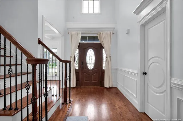 a view of entryway with wooden floor and door