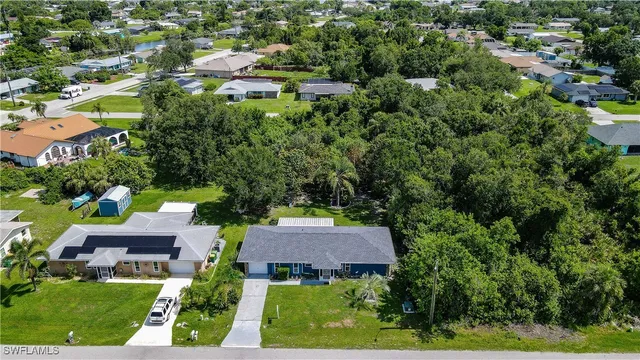 an aerial view of a house with yard swimming pool and outdoor seating