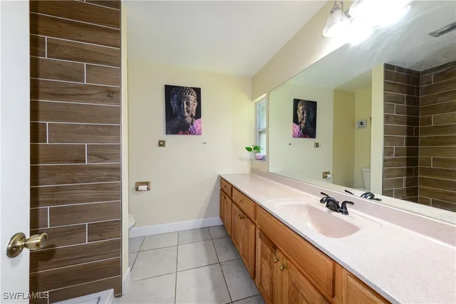 a bathroom with a shower and a sink