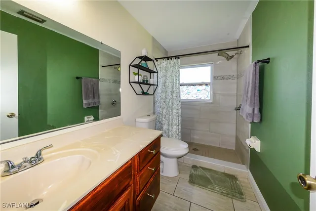 a bedroom with a bed and a table in it